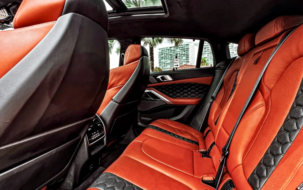 Graphite BMW X6 M Competition — orange leather rear seats