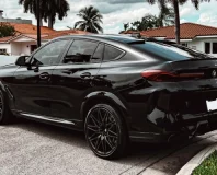 Graphite BMW X6 M Competition — rear three-quarter view