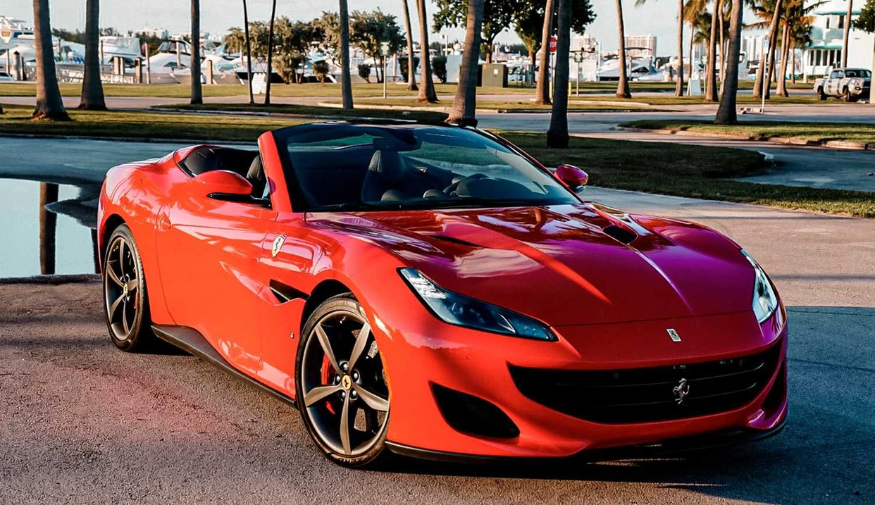 Red Ferrari Portofino with the roof lowered