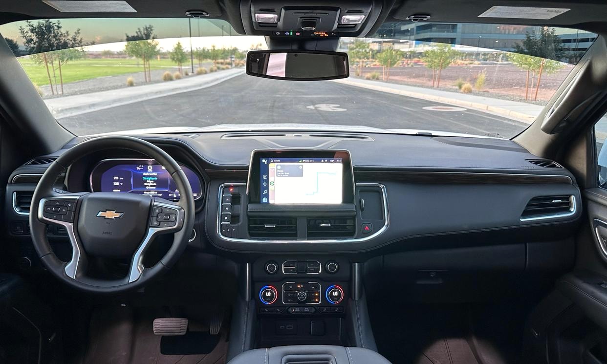 Dashboard and driving controls of the white Chevrolet Tahoe LT