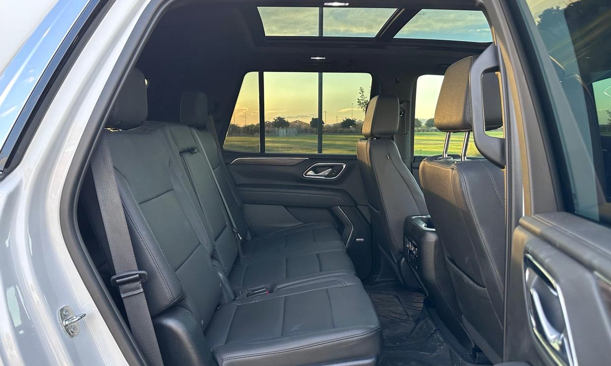 Passenger seating in the white Chevrolet Tahoe LT