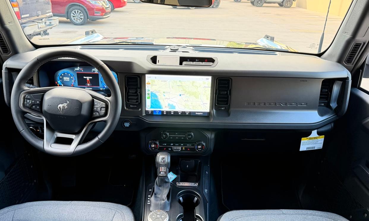 Dashboard and driving controls of the gray Ford Bronco Big Bend