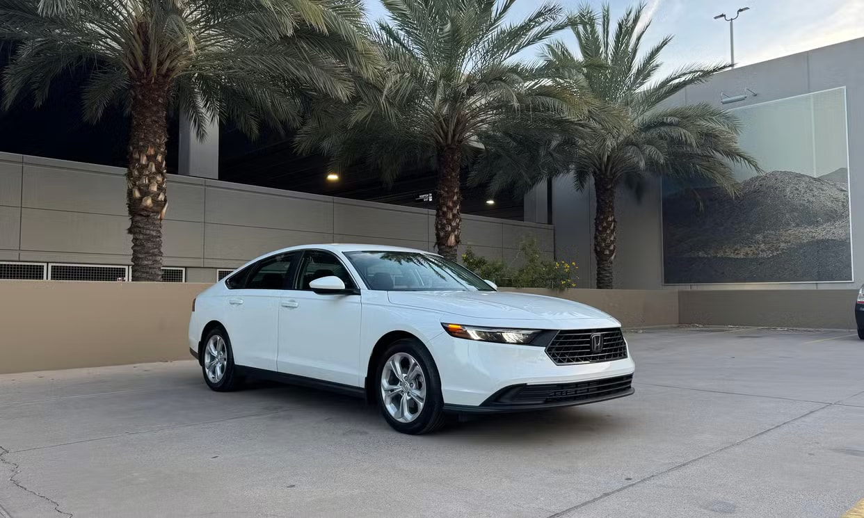 Alternative front three-quarter view of the white Honda Accord LX