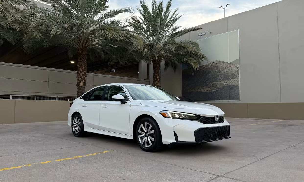 Alternative front three-quarter view of the white Honda Civic LX