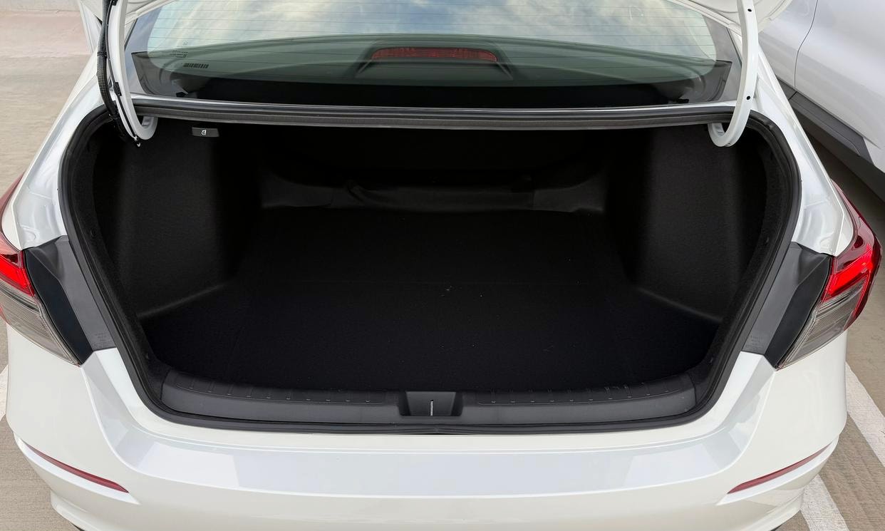 Open cargo area of the white Honda Civic LX