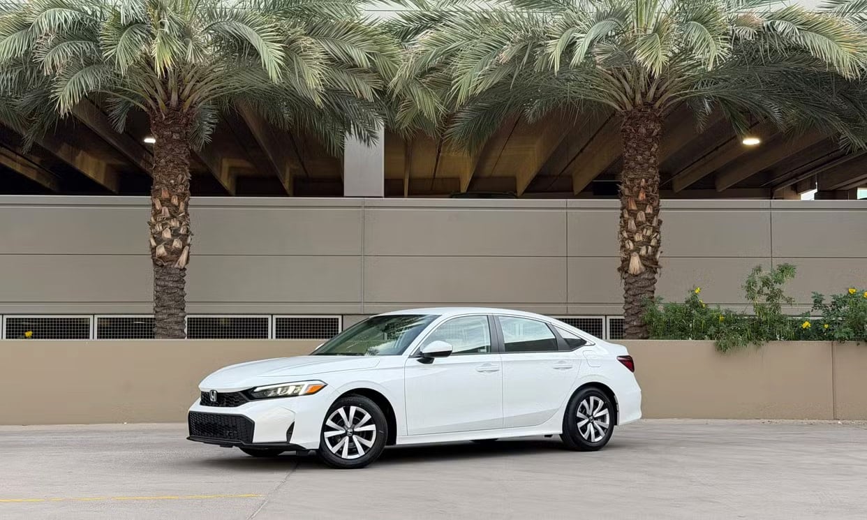 Front three-quarter view of the white Honda Civic LX
