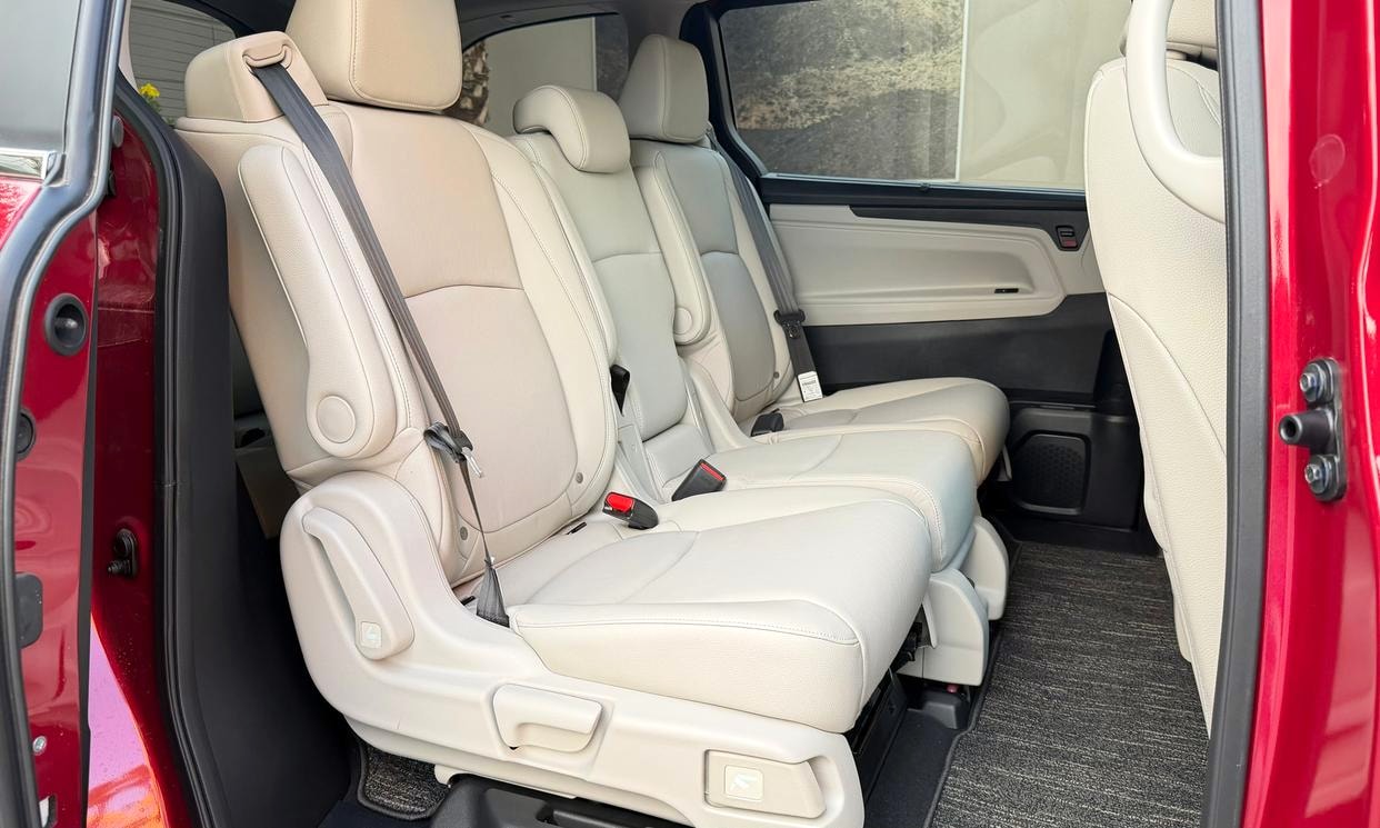 Passenger seating in the red Honda Odyssey EX-L