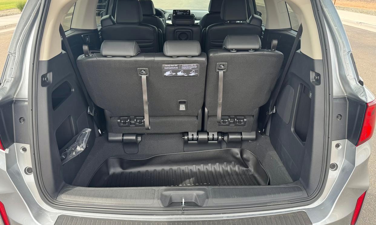 Open cargo area of the silver Honda Odyssey EX-L