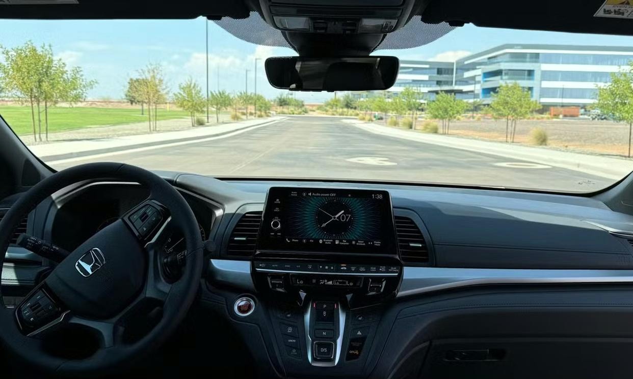 Dashboard and driving controls of the gray Honda Odyssey Sport-L