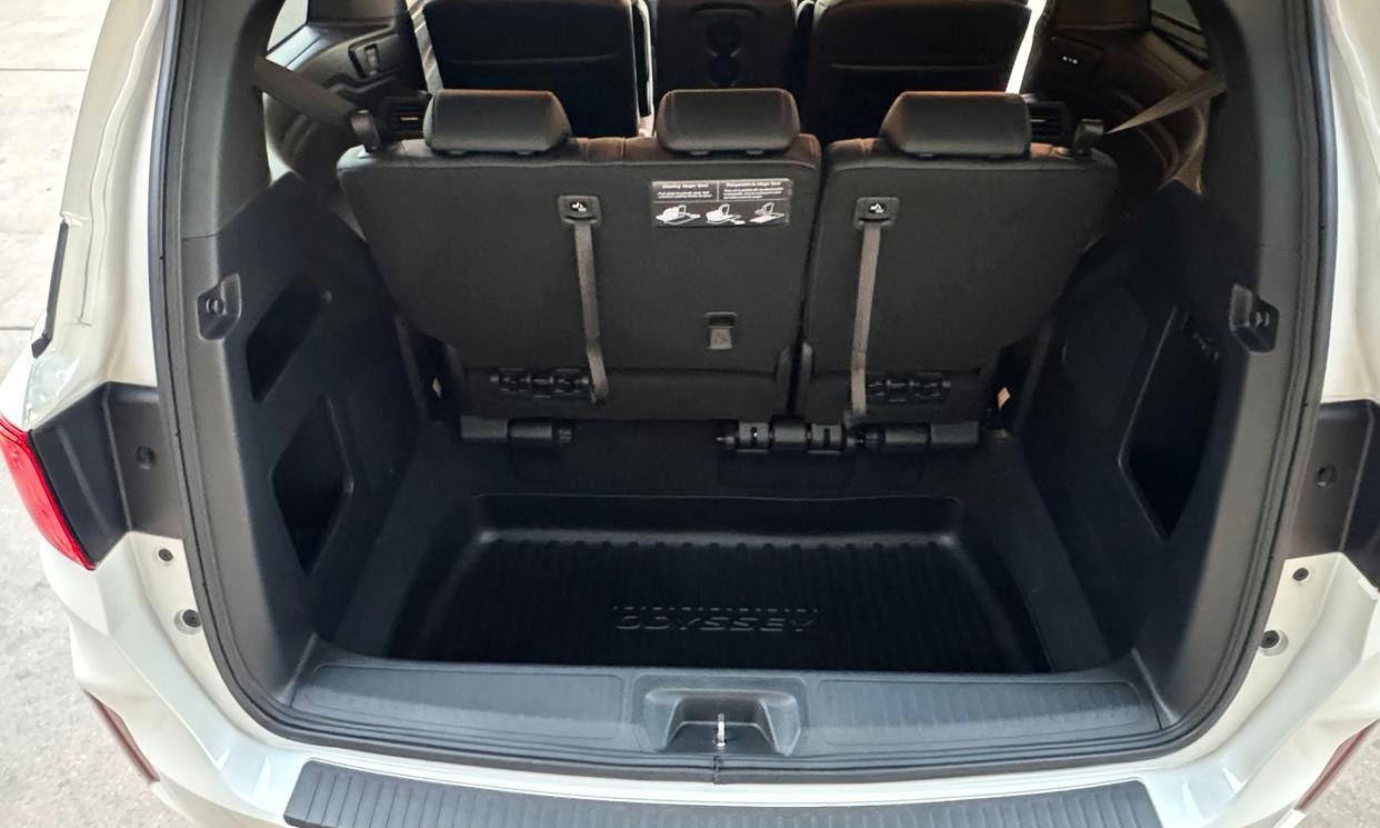 Open cargo area of the white Honda Odyssey Sport-L