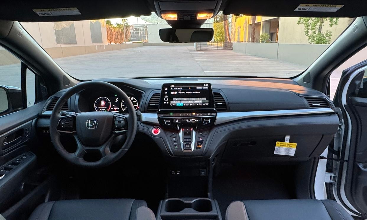 Dashboard and driving controls of the white Honda Odyssey Sport-L