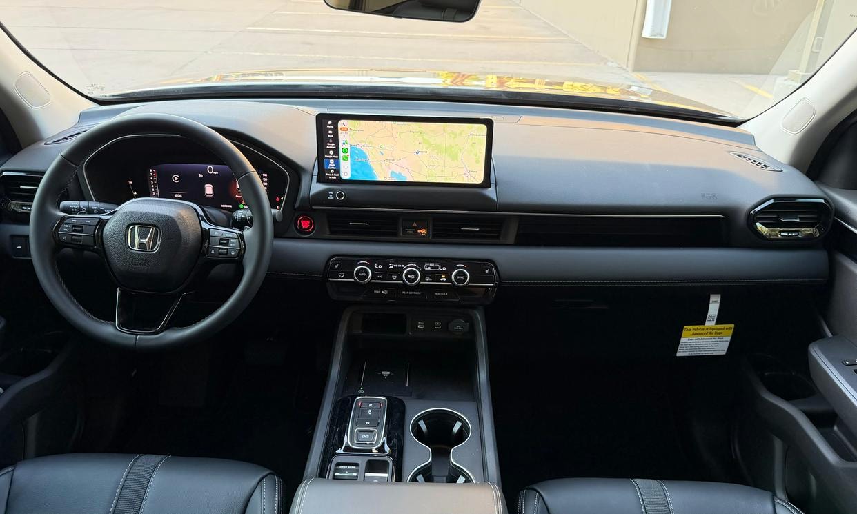 Dashboard and driving controls of the gray Honda Pilot EX-L