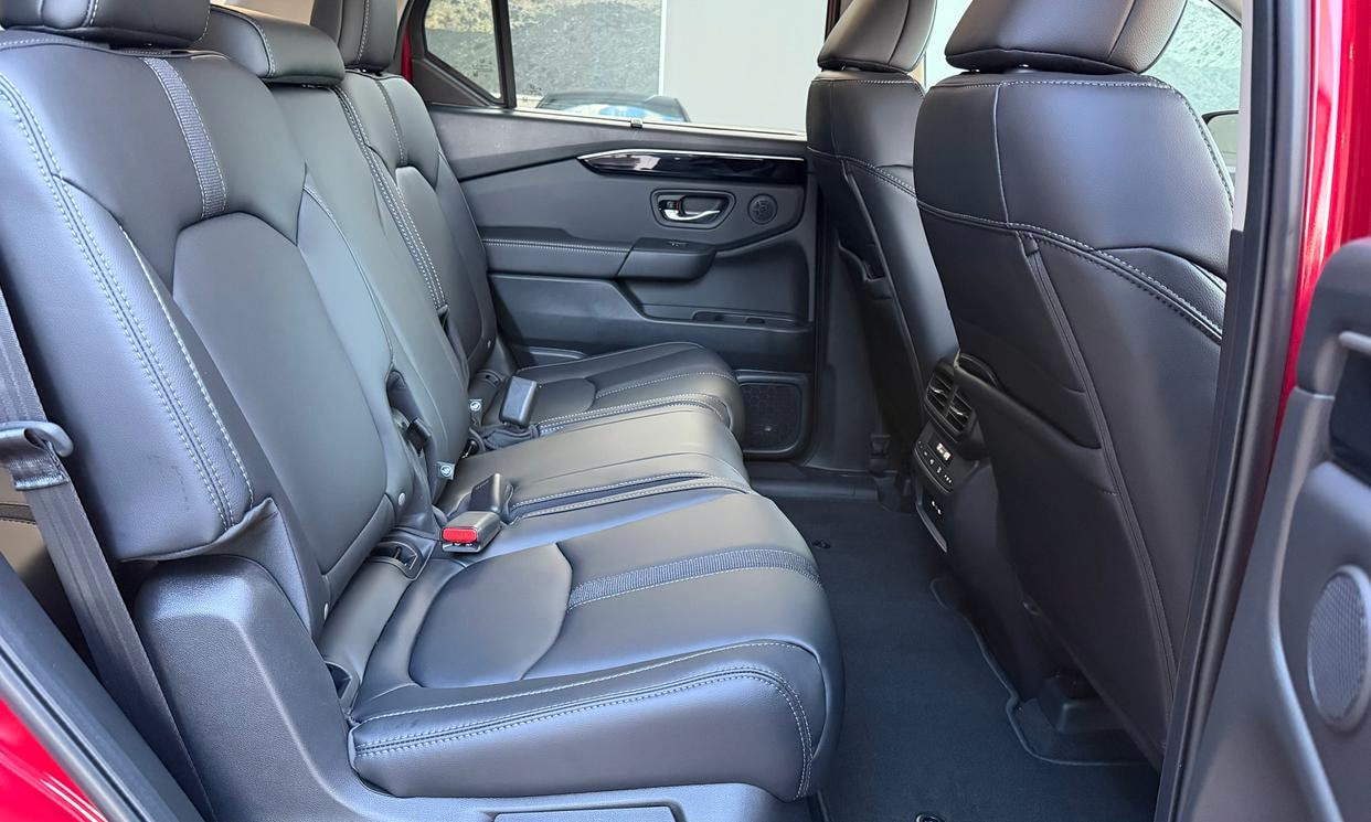 Passenger seating in the red Honda Pilot EX-L