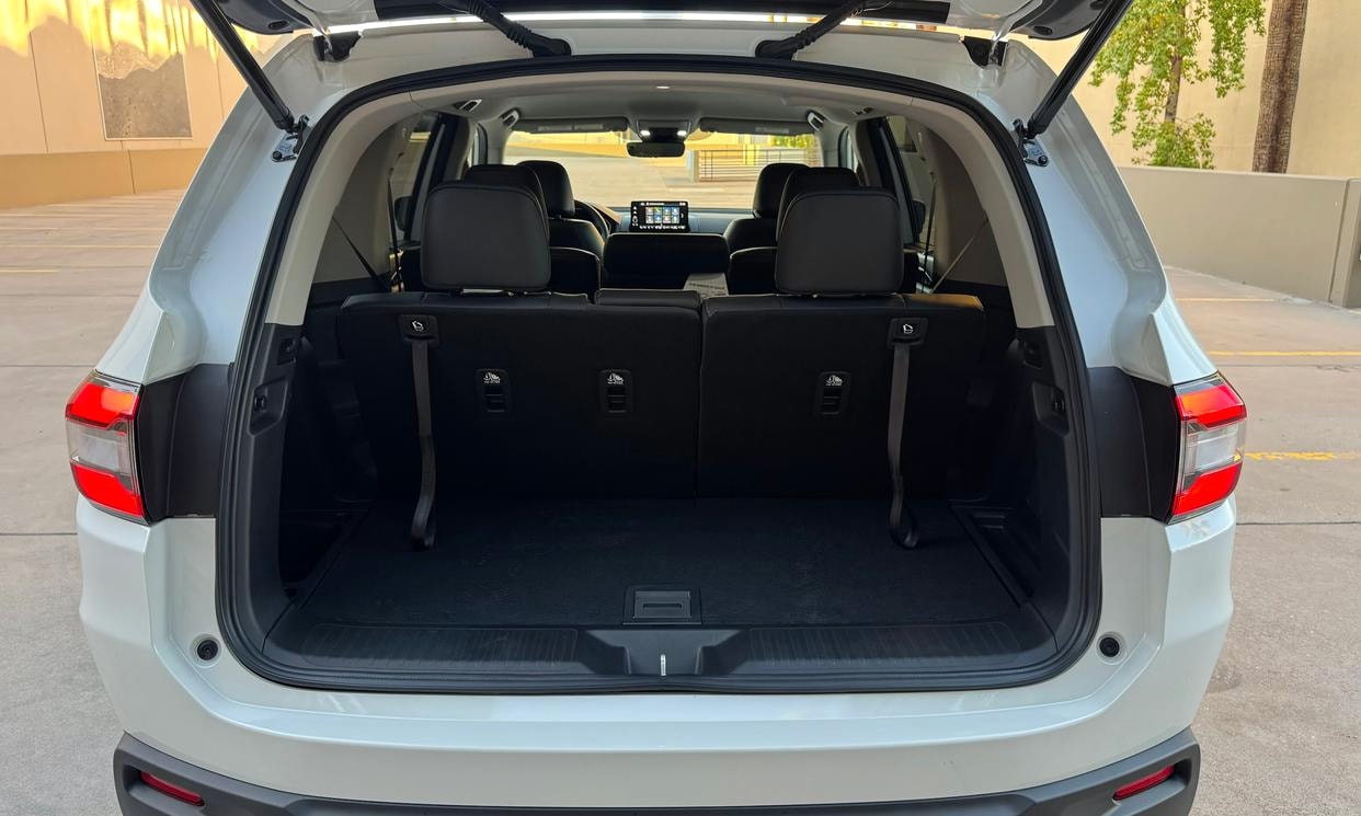 Open cargo area of the white Honda Pilot EX-L