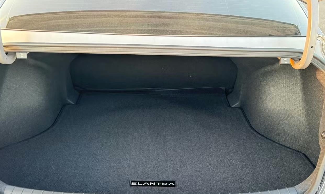 Open cargo area of the white Hyundai Elantra SE