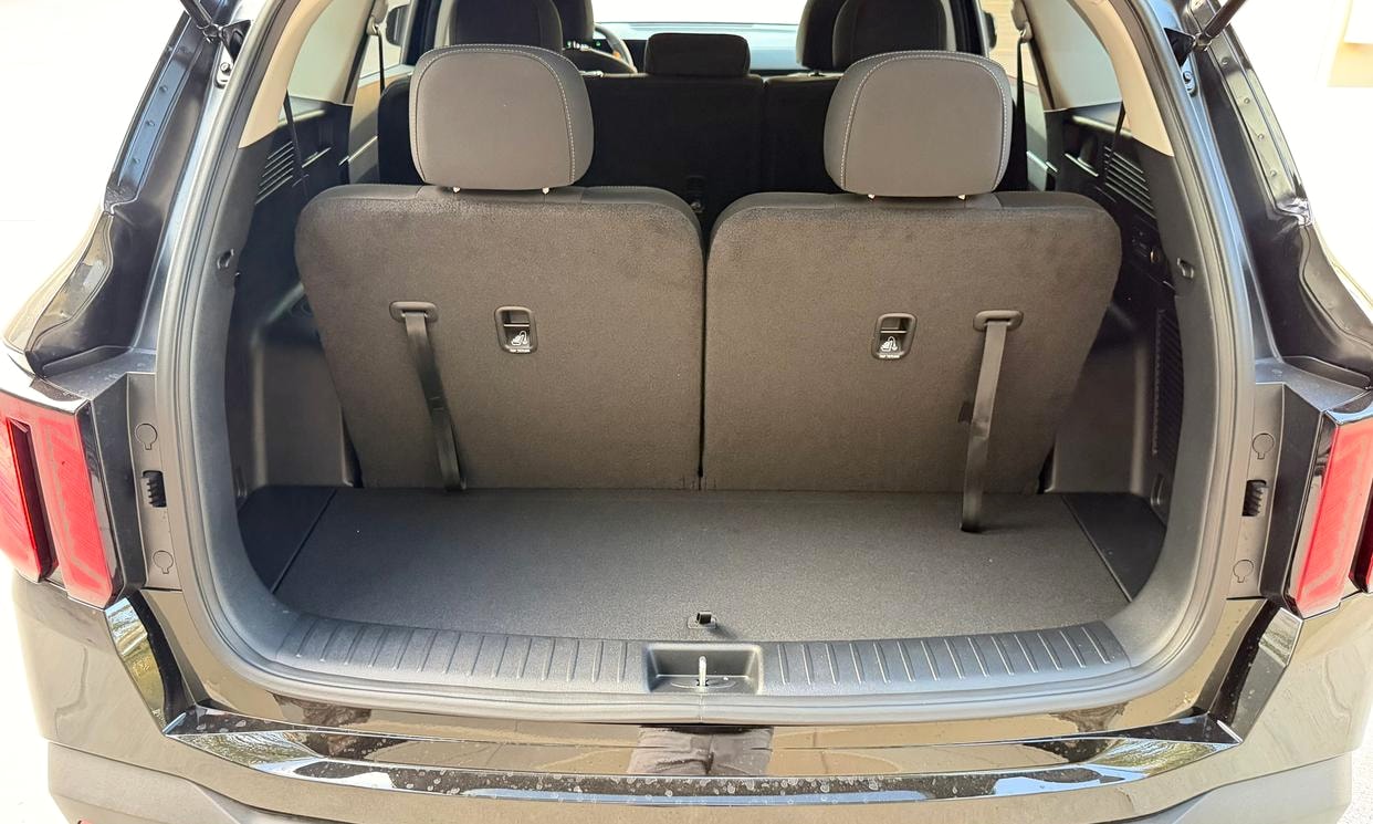 Open cargo area of the black Kia Sorento LX