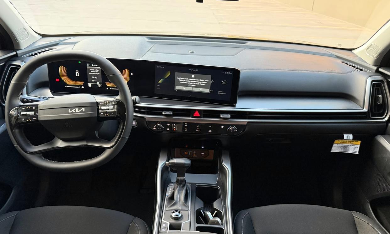 Dashboard and driving controls of the black Kia Sorento LX