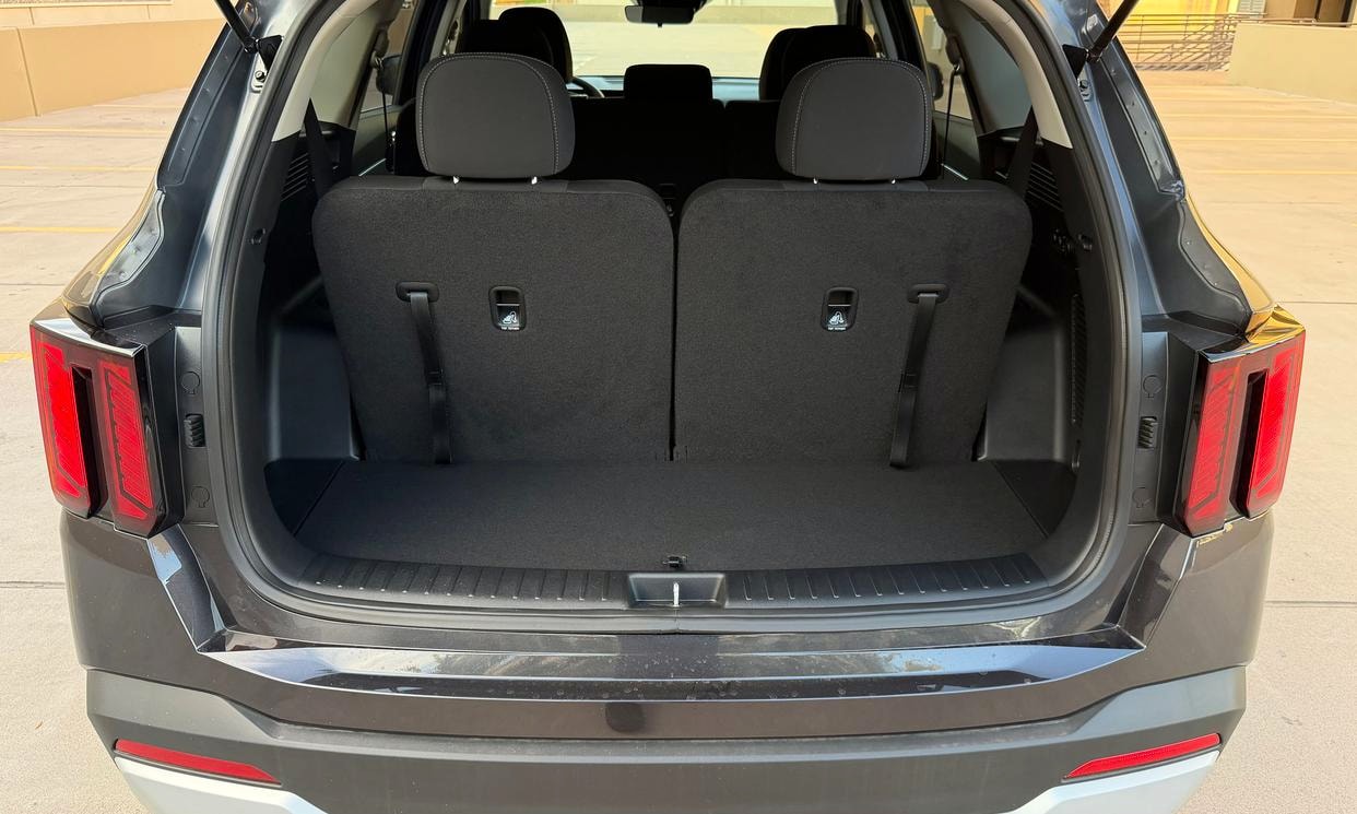 Open cargo area of the gray Kia Sorento LX