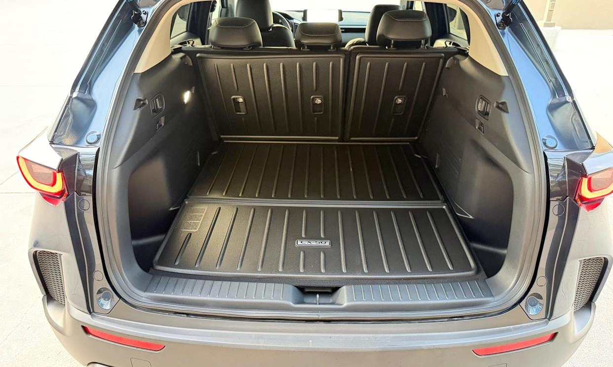 Open cargo area of the blue Mazda CX-50 2.5 S Select