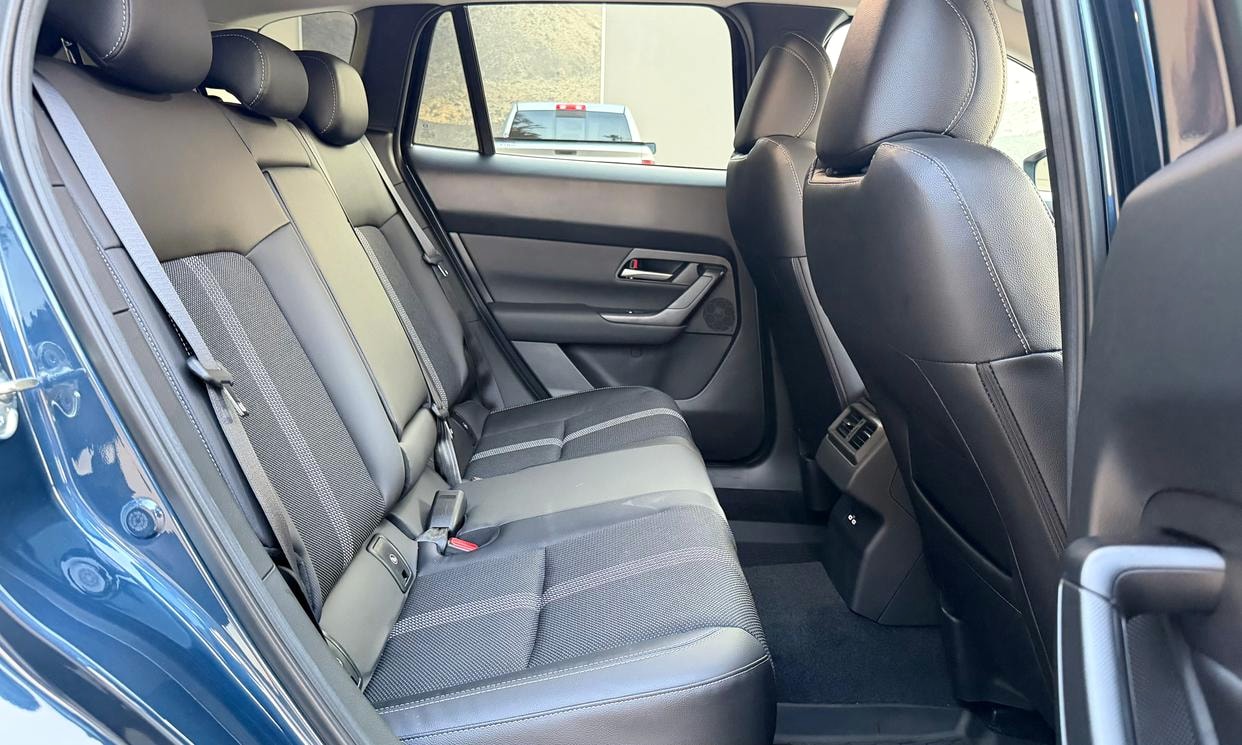 Passenger seating in the blue Mazda CX-50 2.5 S Select