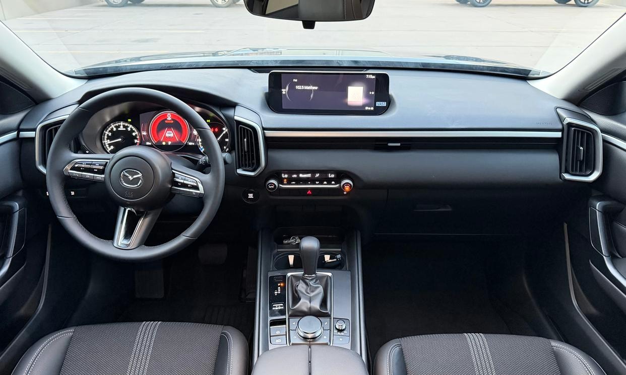 Dashboard and driving controls of the gray Mazda CX-50 2.5 S Select