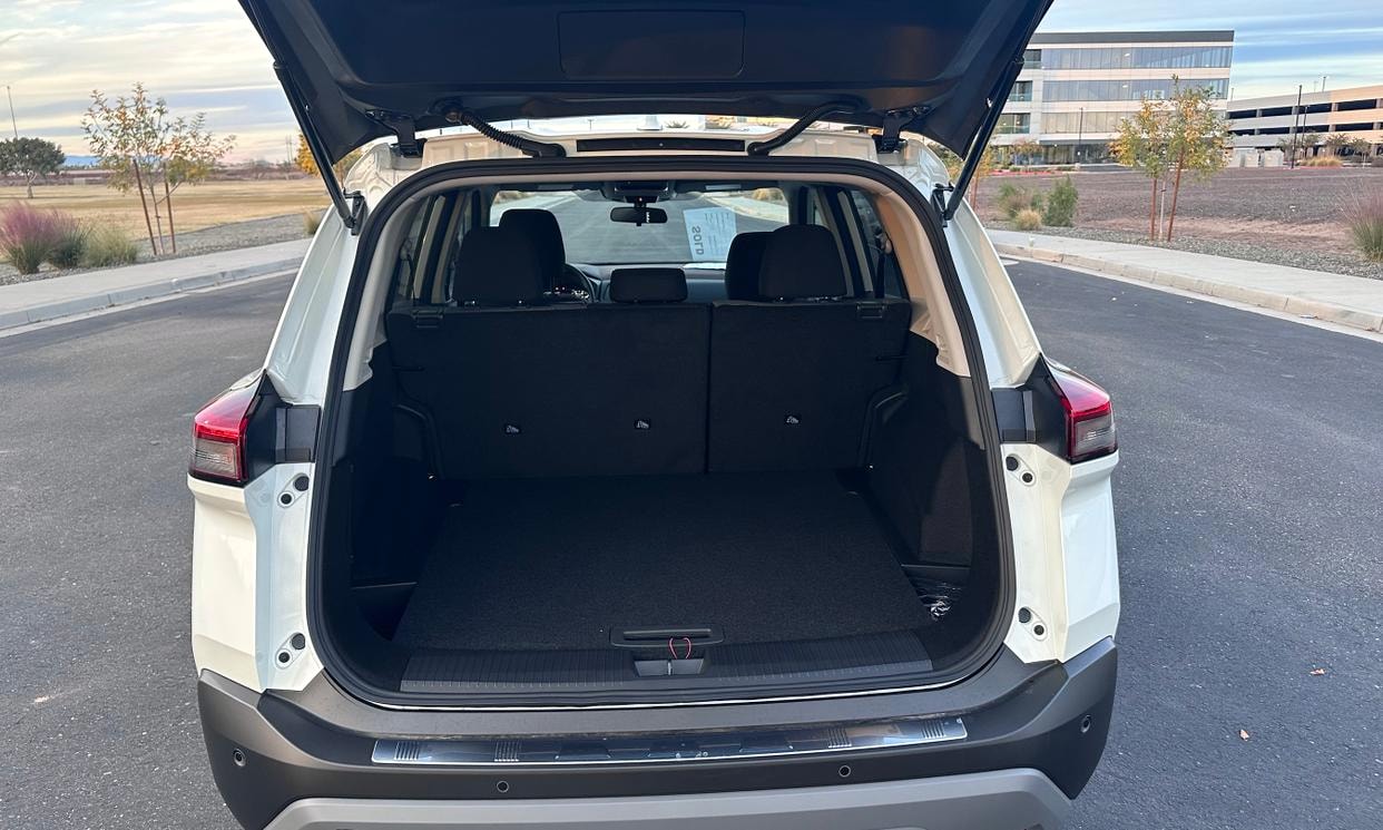 Open cargo area of the white Nissan Rogue SV