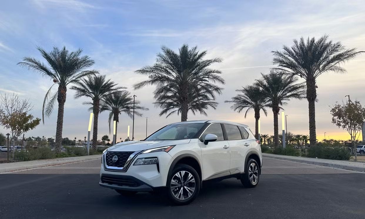 Front three-quarter view of the white Nissan Rogue SV