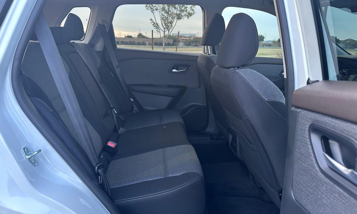 Passenger seating in the white Nissan Rogue SV