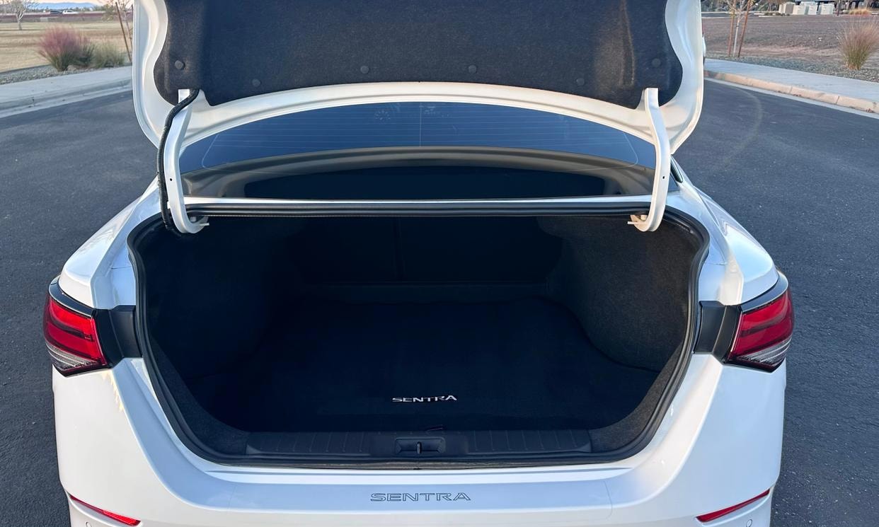 Open cargo area of the white Nissan Sentra S