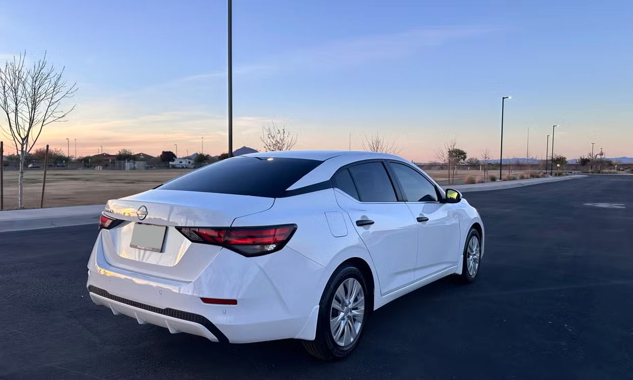 Rear three-quarter view of the white Nissan Sentra S