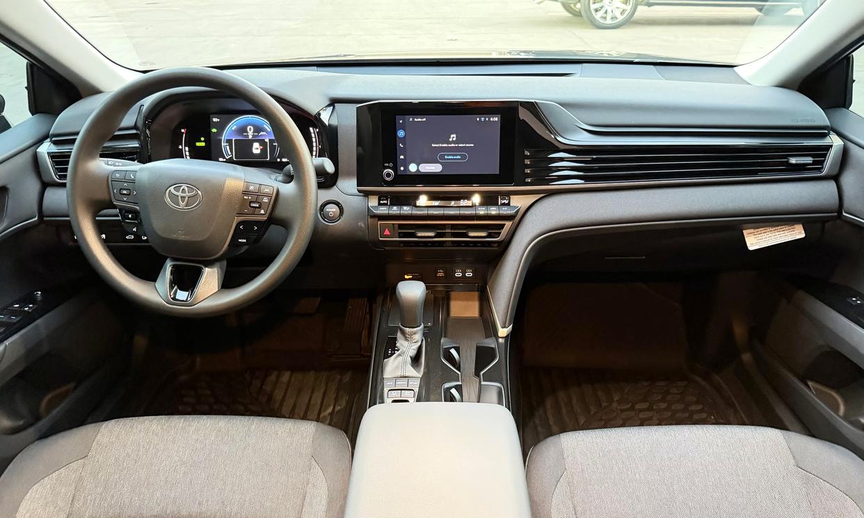 Dashboard and driving controls of the gray Toyota Camry Hybrid LE