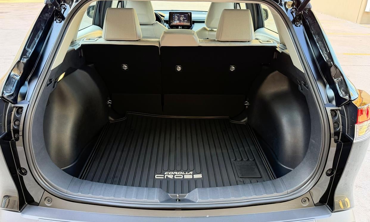 Open cargo area of the black Toyota Corolla Cross L