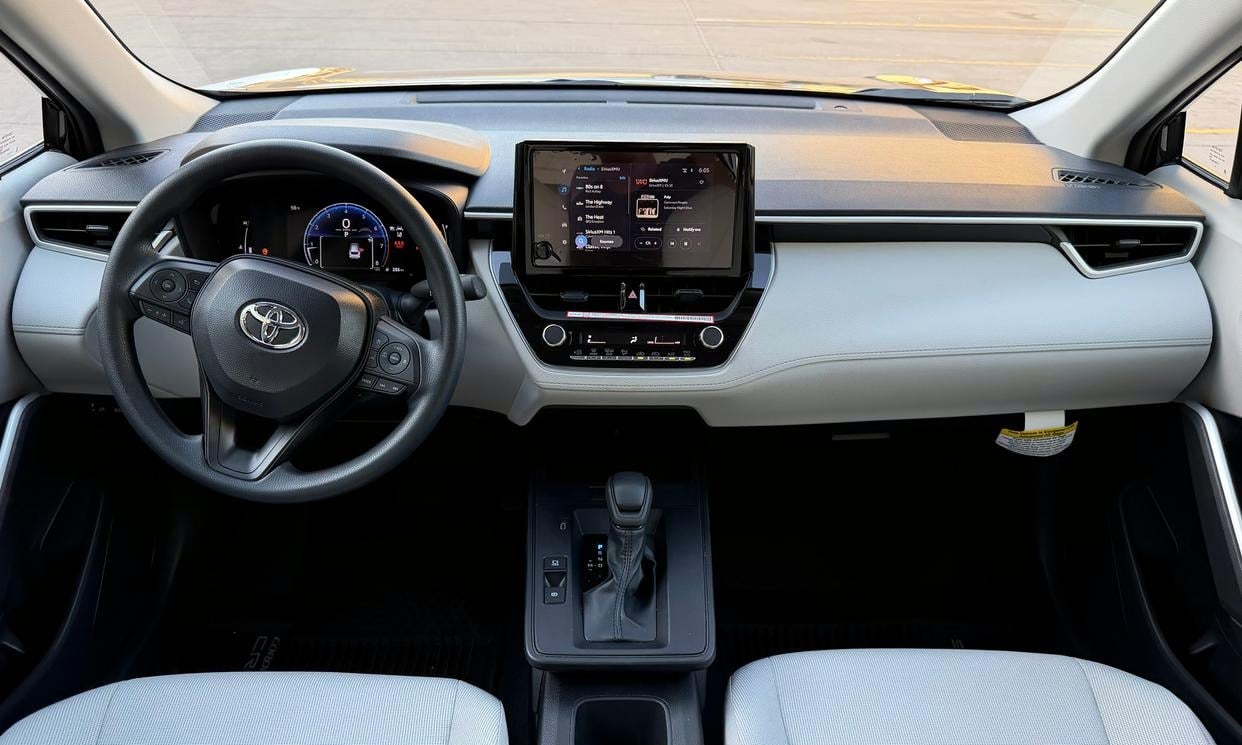 Dashboard and driving controls of the black Toyota Corolla Cross L