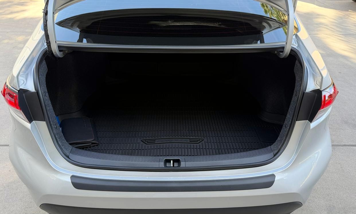 Open cargo area of the silver Toyota Corolla LE