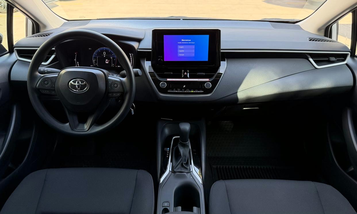 Dashboard and driving controls of the silver Toyota Corolla LE