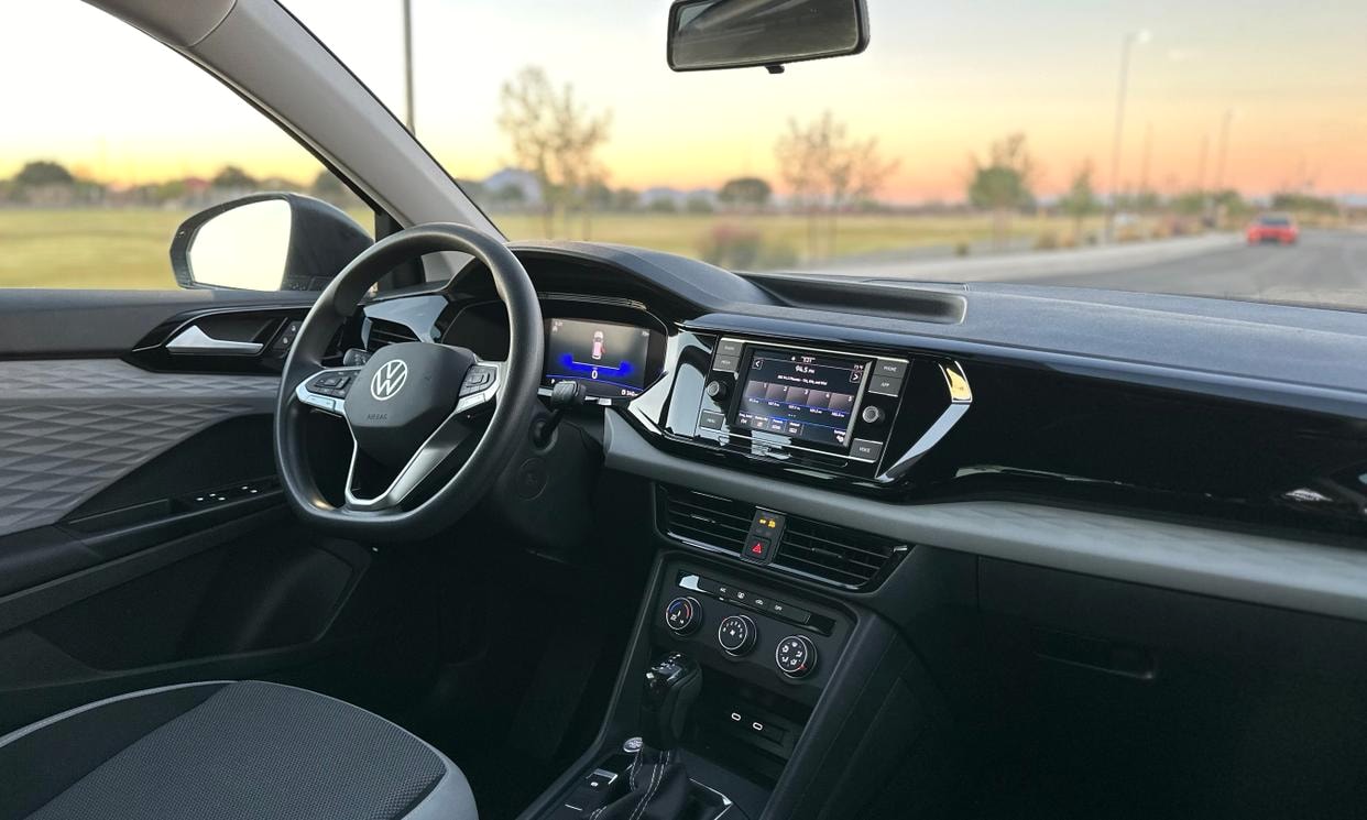 Dashboard and driving controls of the silver Volkswagen Taos S