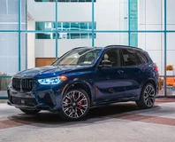 Dark Blue BMW X5 M Rental in Miami, front three-quarter view outdoors