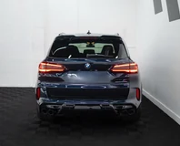 BMW X5 M — Dark blue, rear view indoors