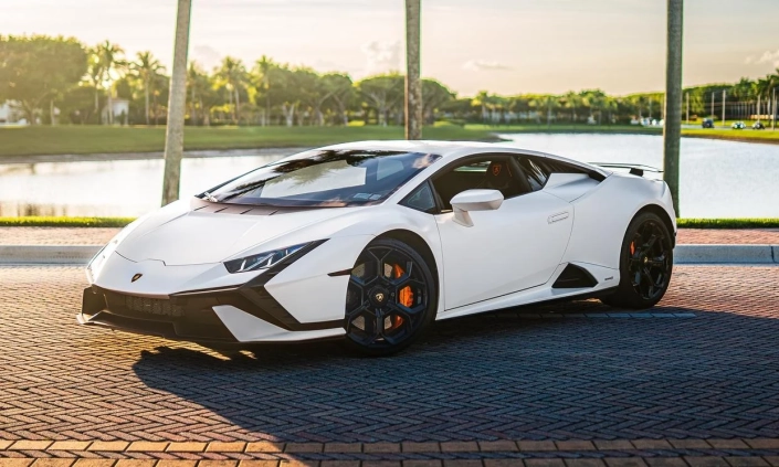 Lamborghini Huracan Tecnica — White, front three-quarter view beside palms