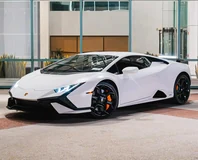 Lamborghini Huracan Tecnica — White, front three-quarter view outside a modern building