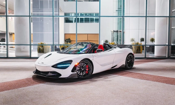 McLaren 720S Spider — White, front three-quarter view with roof open