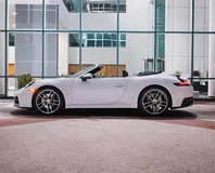Porsche 911 Carrera Cabriolet — White, side profile with roof open