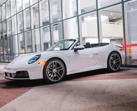 Porsche 911 Carrera Cabriolet — White, wide front three-quarter view