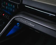 Lamborghini Urus — White, passenger dashboard Lamborghini script
