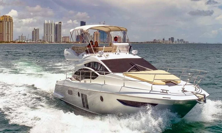White 42-foot Azimut yacht on the water near Miami