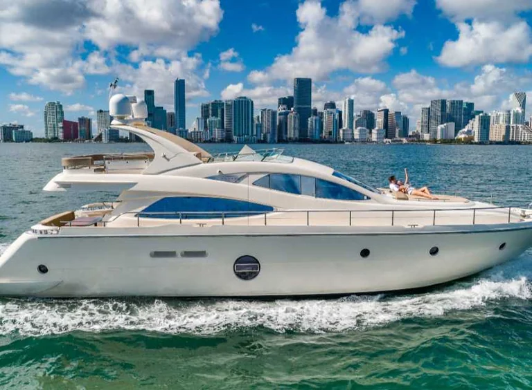 White Aicon 69 yacht viewed from the side on the water